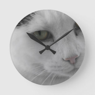 Black and white cats face round clock