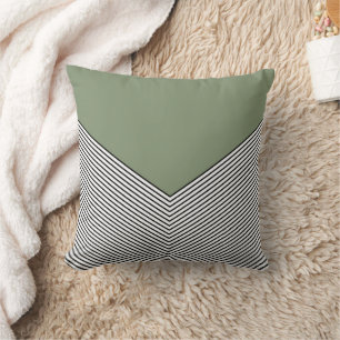 Black and white chevron design and green triangle cushion