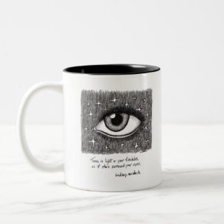black and white coffee mug with quote and art
