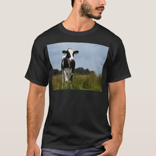 Black And White Cow In Sunny Field. T-Shirt (Front)