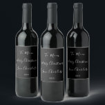 Black and White Custom Name Merry Christmas Wine Label<br><div class="desc">Black and white custom Merry Christmas design with simple script typography. The design has the message “To Mum Merry Christmas Love Charlotte xxx”, adding a personal touch to your gift giving this holiday season. The design is ready for you to personalise by using the personalise this button. Here you can...</div>