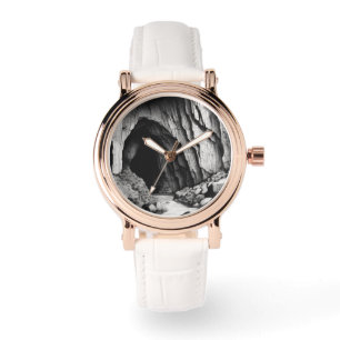 black and white drawing of a cave rose gold watch