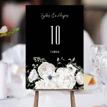 Black and White Elegant Floral Bouquet Modern Table Number<br><div class="desc">Our wedding invitation suite is perfect for couples who want an elegant,  black and white wedding. Our suite includes an elegant black and white,  floral bouquet with white roses,  greenery,  and ferns. This is a perfect suite for a day or night wedding.</div>