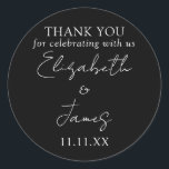 Black And White Elegant Script Wedding Thank You Classic Round Sticker<br><div class="desc">This black and white minimalist elegant script wedding thank you sticker can be personalised with your information in chic typography. Designed by Thisisnotme©</div>