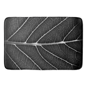 Black and white glowing leaf close-up bath mat