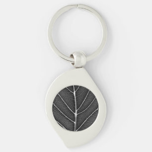 Black and white glowing leaf close-up key ring