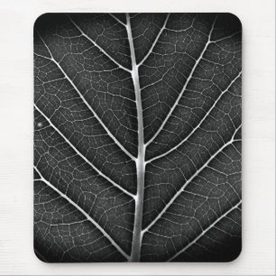 Black and white glowing leaf close-up mouse pad