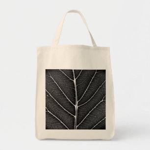 Black and white glowing leaf close-up tote bag