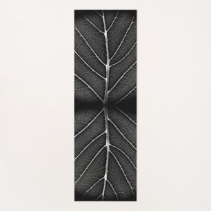 Black and white glowing leaf close-up yoga mat