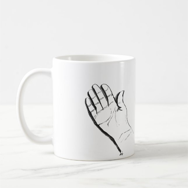 black and white hand on coffee mug (Left)