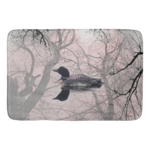 Black and white loon on a lake Bathroom mat pink