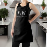 Black and White Minimalist Modern Monogram Apron<br><div class="desc">Introducing our Black and White Minimalist Modern Monogram Collection: Embrace simplicity and sophistication with our minimalist designs, curated to elevate your style effortlessly. Crafted with a keen eye for modern aesthetics, this collection features sleek black and white designs accentuated by personalised monograms. From chic stationery to versatile accessories, our collection...</div>