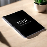 Black and White Minimalist Modern Monogram Notebook<br><div class="desc">Introducing our Black and White Minimalist Modern Monogram Collection: Embrace simplicity and sophistication with our minimalist designs, curated to elevate your style effortlessly. Crafted with a keen eye for modern aesthetics, this collection features sleek black and white designs accentuated by personalised monograms. From chic stationery to versatile accessories, our collection...</div>
