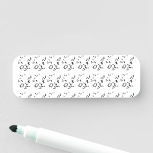 black and white photo of leaves on a white backgro name tag