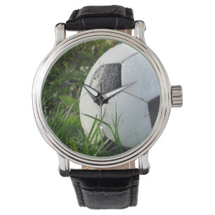 Black and White Soccer Ball in Green Grass Watch