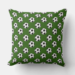 Black and White Soccer Balls on Green Cushion