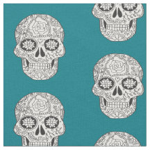 Black and white Sugar Skulls on teal fabric