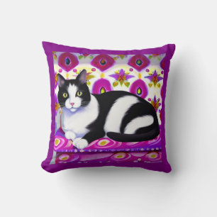 Black and White Tuxedo Cat on a Cushion