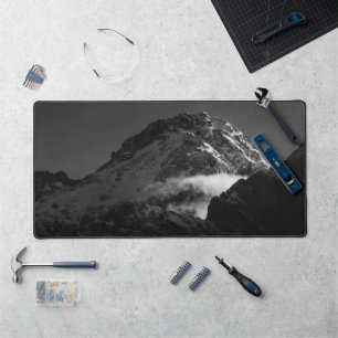 Black and white windy snowy mountain desk mat