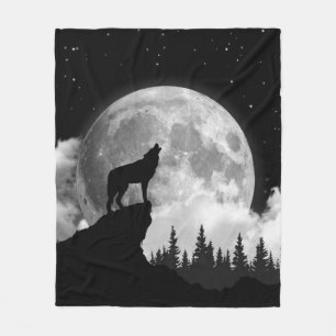 Black and white wolf howling at the moon fleece blanket