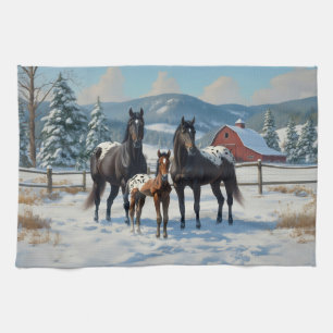Black Appaloosa Horses on a Farm in Winter Tea Towel