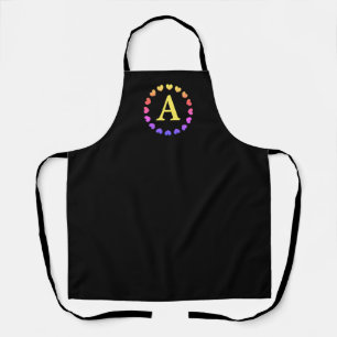 Black apron with rainbow colour hearts and monogra