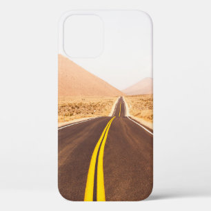 BLACK ASPHALT ROAD IN THE MIDDLE OF BROWN FIELD iPhone 12 CASE