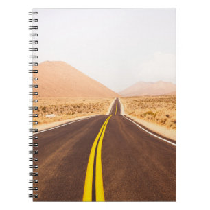 BLACK ASPHALT ROAD IN THE MIDDLE OF BROWN FIELD NOTEBOOK