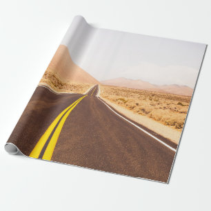 BLACK ASPHALT ROAD IN THE MIDDLE OF BROWN FIELD WRAPPING PAPER