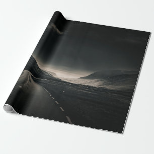 BLACK ASPHALT ROAD NEAR MOUNTAIN DURING DAYTIME WRAPPING PAPER