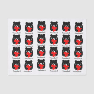 Black bear holding a heart tissue paper