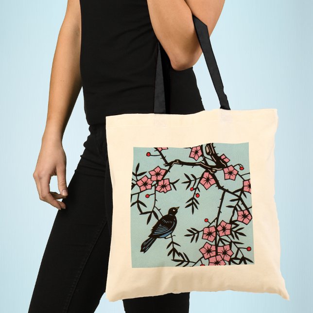 Black Bird Cherry Blossom Tree Tote Bag (Black bird in cherry tree with pink blossom flowers on light blue tote bag.)