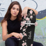 Black BLUSH Pink Cherry Blossom Monogram  Skateboard<br><div class="desc">Stand out at the skatepark with this beautifully designed skateboard featuring soft pink cherry blossoms on a deep black background. This custom deck adds a delicate, feminine flair to bold street style – perfect for skaters who want to express strength and grace. Personalise it with your name for a one-of-a-kind...</div>