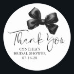 Black Bow Favours Bridal Shower Thank You  Classic Round Sticker<br><div class="desc">Add a Touch of Charm with These Elegant Black Bow Thank You Stickers. Looking to give your party favours and gifts that perfect finishing touch? These black bow thank you stickers are just what you need! Featuring a beautiful black sating bow paired with graceful, handwritten-style script, they bring a warm...</div>