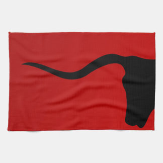 Black bull on red tea towel