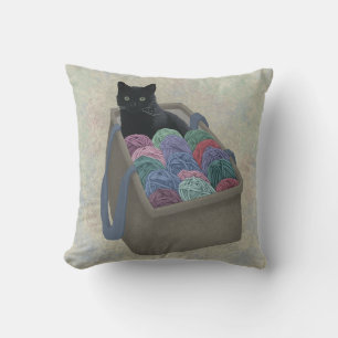 Black cat in yarn bag  cushion