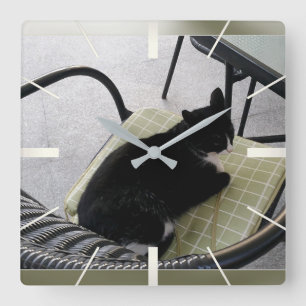 Black cat on a terrace square wall clock