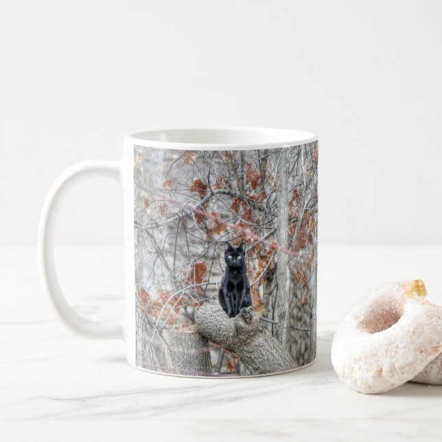 Black Cat Sitting Outdoors Coffee Mug (With Donut)