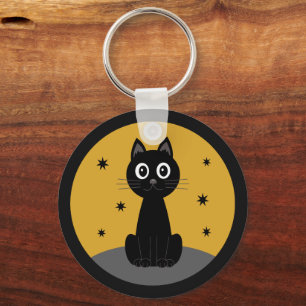 Black cat sitting watching the stars key ring