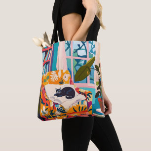 Black cat sleeping on the sofa tote bag