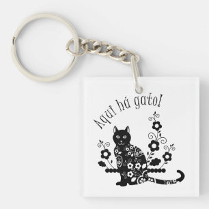 Black cat with flowers and Portuguese expression Key Ring
