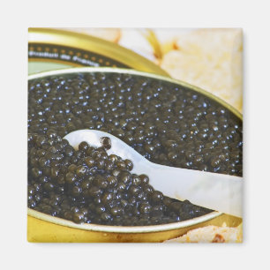 Black caviar and a spoon of mother-of-pearl to magnet