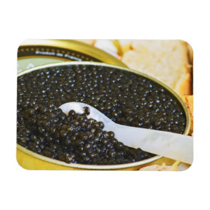Black caviar and a spoon of mother-of-pearl to magnet