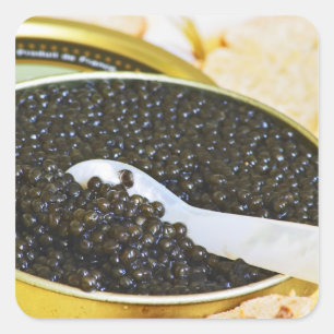 Black caviar and a spoon of mother-of-pearl to square sticker
