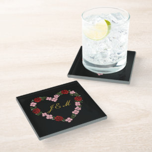 Black coaster with a pink and red heart
