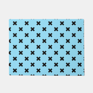 Black cross stitches on baby blue doormat