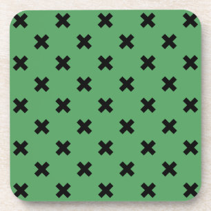 Black cross stitches on green coaster