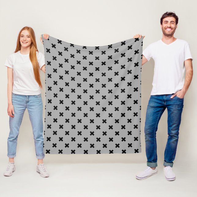 Black cross stitches on grey fleece blanket (In Situ)