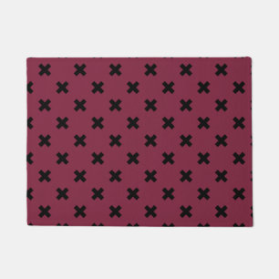 Black cross stitches on mulberry doormat