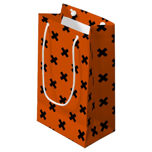 Black cross stitches on orange small gift bag (Front Angled)